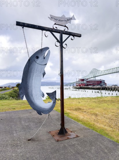 Fish sculpture in front of the Astoria Megler Bridge on the Columbia River, Astoria, Oregon, USA, North America