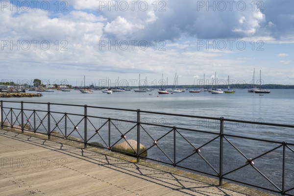 Sailboats in the harbour, promenade, dark clouds, Eckernförde, Baltic Sea, Schleswig-Holstein, Germany