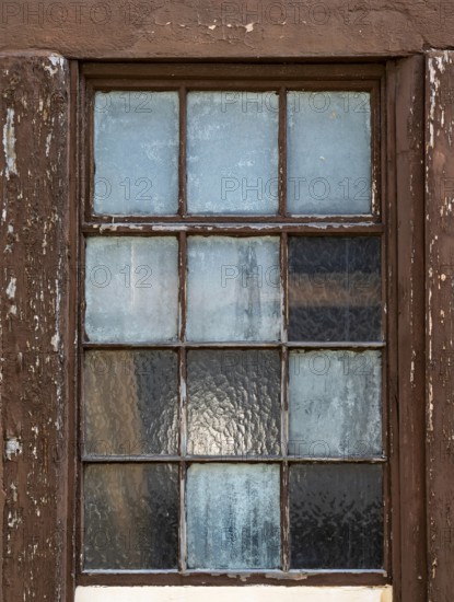 Old window with weathered wooden frame and frosted glass, reflects light, Bad Bergzabern, Southern Palatinate, Palatinate, Rhineland-Palatinate, Germany