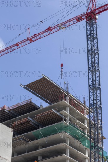 Detroit, Michigan - Construction of the 25-story JW Marriott Detroit Water Square hotel. The framework for a new floor is lowered into place, cement will then be poured over it