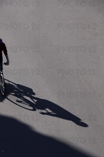 Shadow of a cyclist, Summer, Germany