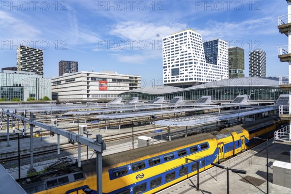 Utrecht Centraal railway station, tracks and concourse, trains of Nederlandse Spoorwegen N.V. state railway company, office building in the city centre, Netherlands