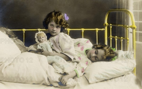 2 girls bed doll, 1920s, Two girls in a bed, one holding a doll, nostalgic and peaceful atmosphere, Historical photo