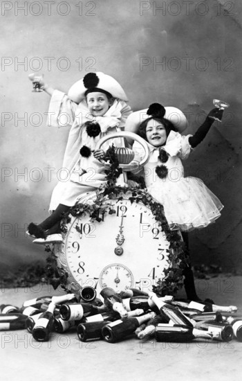12 o'clock New Year's Eve Prosit, 1920s, Two children dressed as clowns, sitting on a large clock, festive atmosphere, historical photo