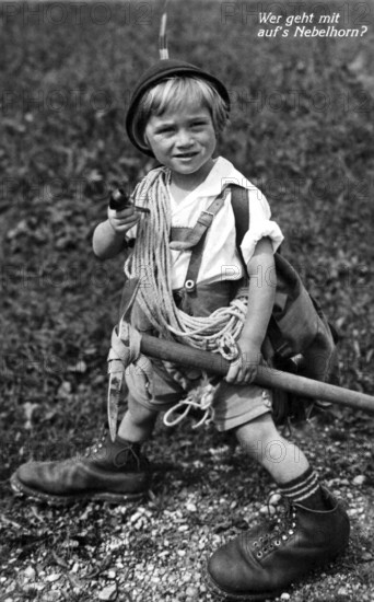 Mountaineering Nebelhorn, 1930s, A young boy in traditional clothing, equipped for mountaineering, smiles, Historical photo