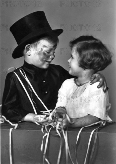 Boy as a chimney sweep with a girl, 1920, A boy in disguise with a girl at his side, Historical photo