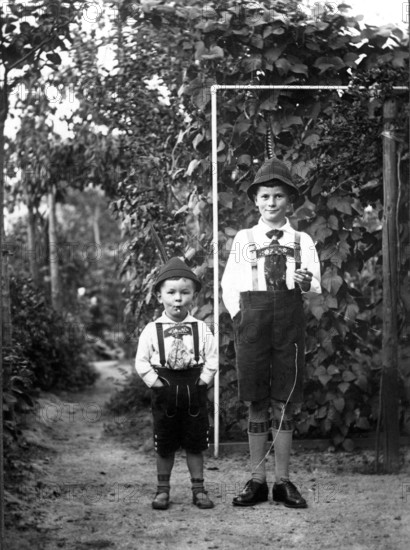 Big and little boy, 1920, Two boys in traditional traditional costume proudly posing in their Bavarian outfit, Historical photo