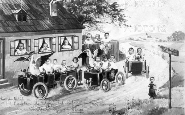 Two storks and a bunch of babies, 1920s, Children driving miniature cars on a rural road in a humorous scene, Historical photo