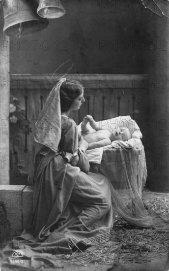 Mother with child, 1920s, woman in historical dress looking at child in hay, heavenly scenery, historical photo
