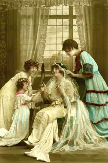 Bride bridesmaids, 1910s, woman and a girl in historical dress with mirror in an elegant room with flower wreaths, historical photo