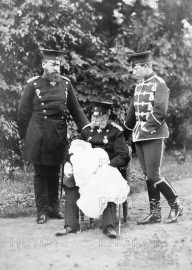 Original photo of the three emperors William I, Frederick III and William II with their son, 1910s, Three men in military uniforms standing with a baby in the countryside, Historical photo