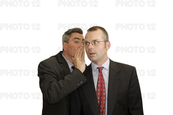 Businessman, two, whispering, communication, suit and tie, Berlin, Germany, man in suit whispering in another man's ear, they seem to share a secret, historical photo