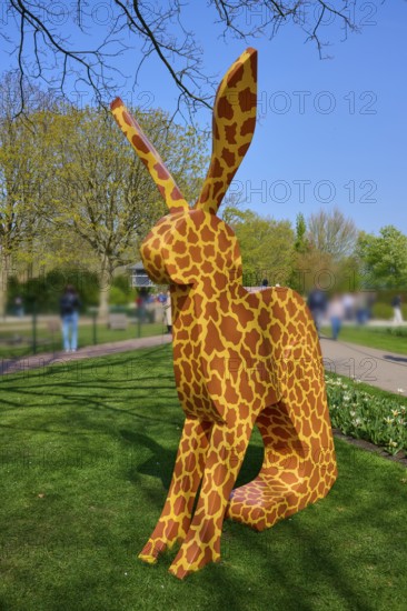 Bunny sculpture with pattern in a park under a blue sky, Keukenhof, Lisse, province of South Holland, Netherlands