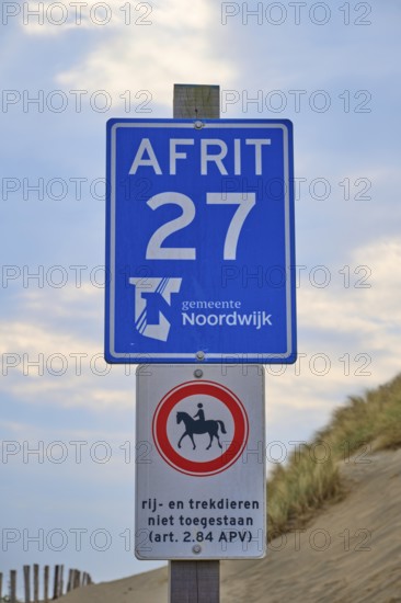 Two beach signs with a note, at the edge of the dunes, beach section 27, Noordwijk, North Sea, Province of South Holland, Netherlands