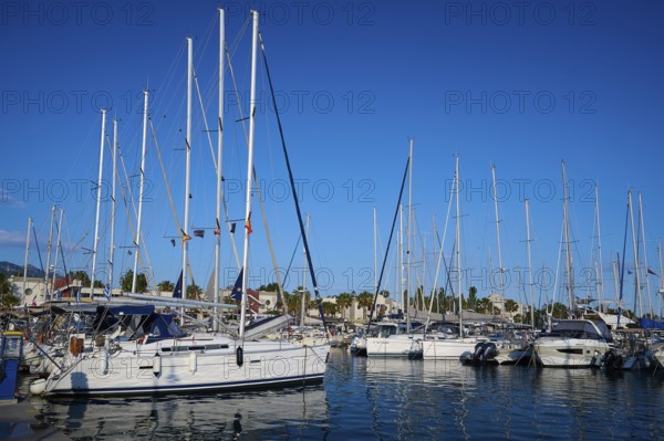 A harbour full of sailing boats and yachts against a clear blue sky, Marina, Kos Town, Kos, Dodecanese, Greek Islands, Greece