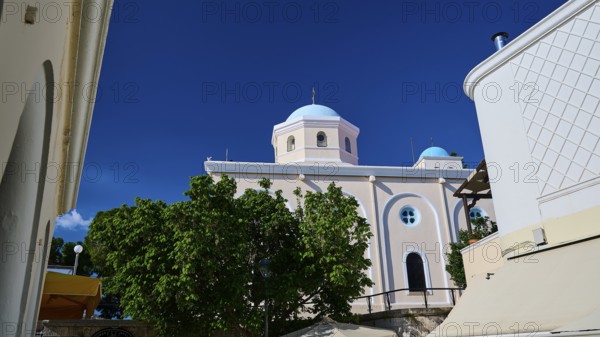 Mediterranean church with blue dome and green trees under a blue sky, Agia Paraskevi Church, Kos Town, Kos, Dodecanese, Greek Islands, Greece