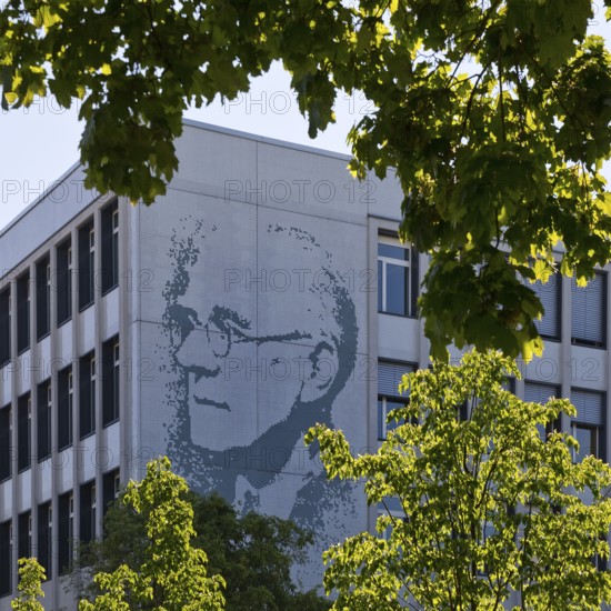 Vocational school centre Mitte Peter-Behrens-Schule with the portrait of Peter Behrens on the exterior facade, Darmstadt, Hesse, Germany