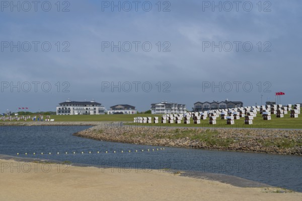 Beach chairs on the family lagoon, Perlebucht, Büsum, North Sea, Schleswig-Holstein, Germany