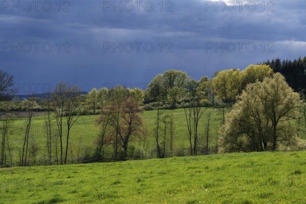 Rain clouds in a spring landscape, Franconia, Bavaria, Germany