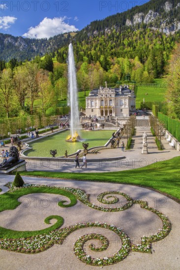 Water parterre with large fountain and portal of Linderhof Castle in spring, municipality of Ettal, Ammergau Alps, Ammertal, Upper Bavaria, Bavaria, Germany