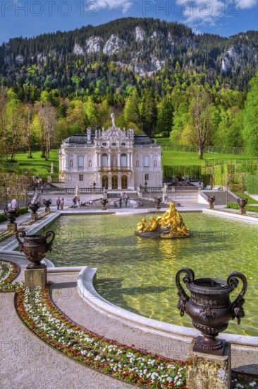 Water parterre with flora fountain and the portal of Linderhof Castle in spring, municipality of Ettal, Ammergau Alps, Ammertal, Upper Bavaria, Bavaria, Germany