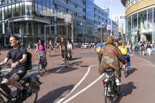Central cycle path along the Vredenburg, in the city centre of Utrecht, lanes for pedestrians, cyclists and local traffic are separated, dense traffic, no car/truck traffic, Utrecht, Netherlands