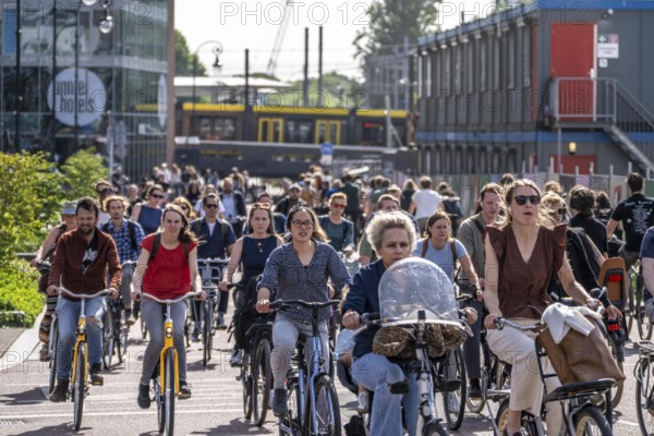 Central cycle path along the Vredenburg, behind the main station, Utrecht Centraal, in the city centre lanes for pedestrians, cyclists and local traffic are separated, dense traffic, no car/truck traffic, Utrecht, Netherlands