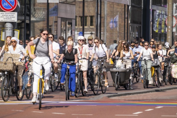 Central cycle path along the Vredenburg, in the city centre of Utrecht, lanes for pedestrians, cyclists and local traffic are separated, dense traffic, no car/truck traffic, Utrecht, Netherlands