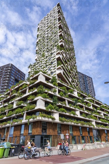 Wonderwoods residential tower, one of 2 green buildings, in Utrecht in the new Healthy Urban Quarter, at the central station, 105 metres high with 30 floors, Tower II, over 360 trees and over 9600 shrubs and flowering plants native to the region, all irrigated with collected rainwater, sponge city principle and monitored with sensors, Utrecht, Netherlands