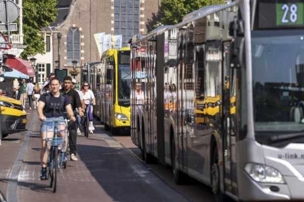 Central cycle path on the Lange Viestraat, lanes for pedestrians, cyclists and local traffic are separated in the city centre, dense traffic, no car/truck traffic, Utrecht, Netherlands