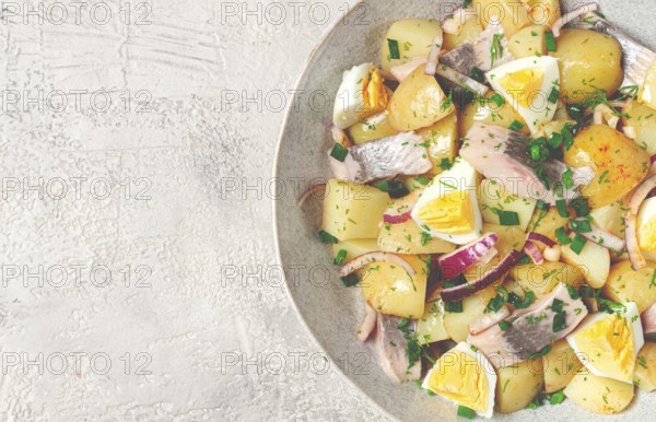 Potato salad with herring and eggs, Scandinavian cuisine, homemade, no people