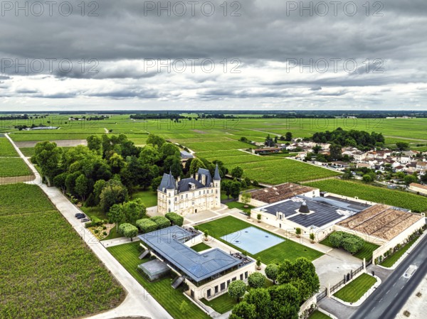 Chateau Pichon Longueville Baron Vineyard and grape fields around Pauillac from a drone, Bordeaux, Gironde, Nouvelle-Aquitaine, France