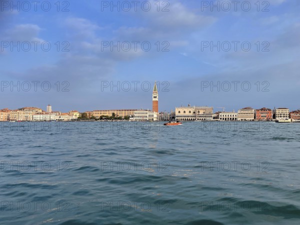 View over the lagoon to Venice with St Mark's Tower, lagoon city of Venice, Veneto, Italy