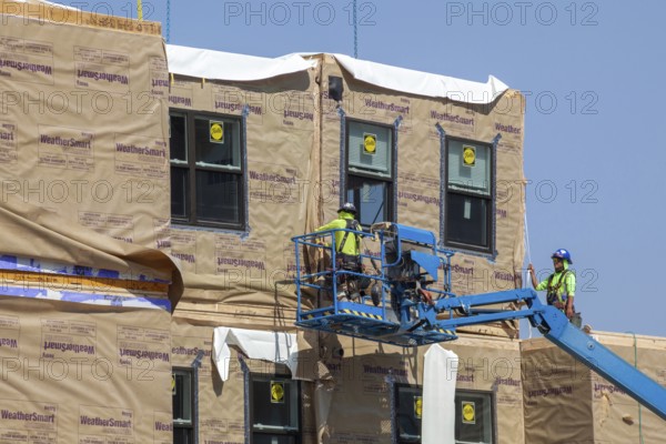 Detroit, Michigan - Workers use modular construction methods to build apartments for low to moderate income households. Each module is put together off site by Ginosko Modular