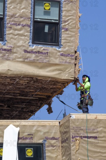 Detroit, Michigan - Workers use modular construction methods to build apartments for low to moderate income households. Each module is put together off site by Ginosko Modular