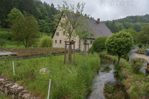 Former corn mill with mill stream, Großenohe, Upper Franconia, Bavaria, Germany