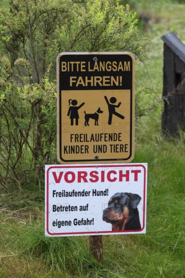 Warning signs in front of a farm, Bavaria, Germany