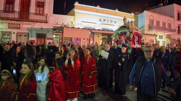 Good Friday, Epitaphios, procession, night procession of traditionally dressed people along illuminated buildings, Skala, harbour, Patmos, Dodecanese, Greek Islands, Greece