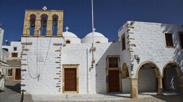 Church of Agios Ioannis Prodromos, white church with bell tower under a blue sky, traditional Mediterranean architecture, Skala, harbour, Patmos, Dodecanese, Greek Islands, Greece