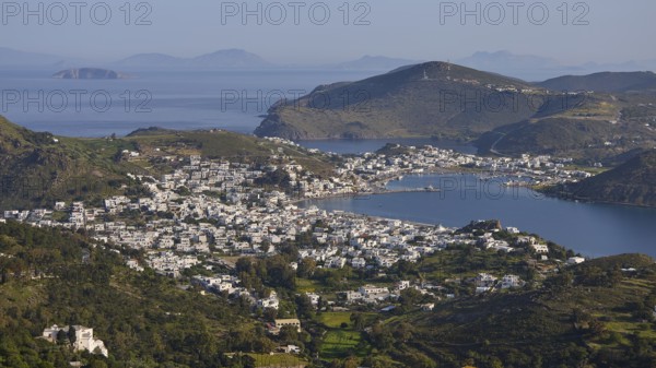 Far-reaching panorama of a town between hills and sea, islands in the distance, Skala, harbour, Patmos, Dodecanese, Greek Islands, Greece
