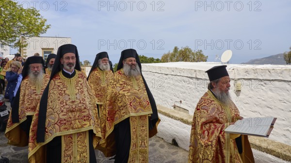 Priests in golden robes read from a Bible during a procession, Orthodox ceremony, monks of St John's Monastery, ceremonial washing of feet, procession, Maundy Thursday, Megali Pempti, Chora, Patmos, Dodecanese, Greek Islands, Greece