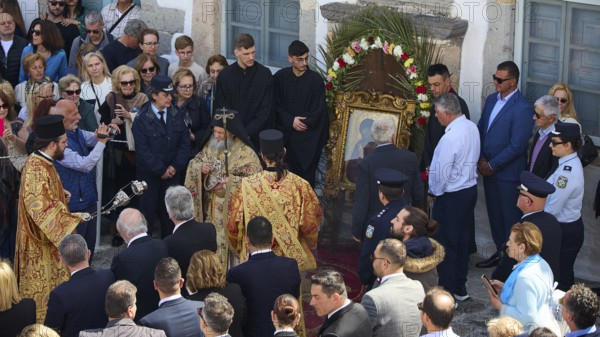 Priests and people gather in a ceremony around an icon, some wearing traditional vestments, others taking photos, Orthodox ceremony, monks of St John's Monastery, ceremonial washing of feet, procession, Maundy Thursday, Megali Pempti, Chora, Patmos, Dodecanese, Greek Islands, Greece