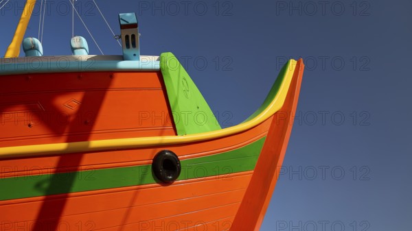 Close-up of the boat bow with orange and green paint, Diakofti boatyard, new construction of a coloured wooden boat, Diakofti, Patmos, Dodecanese, Greek Islands, Greece