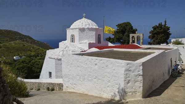 Whitewashed chapel with a view of the sea and surrounding green landscape, church, Chora, World Heritage Site 1999, Patmos, Dodecanese, Greek Islands, Greece