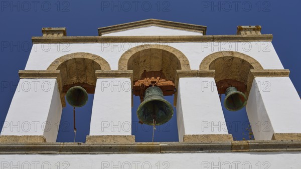 Cross-domed church of Panagia Diasosousan, white bell tower with three bells against a clear sky, church, Chora, World Heritage Site 1999, Patmos, Dodecanese, Greek Islands, Greece