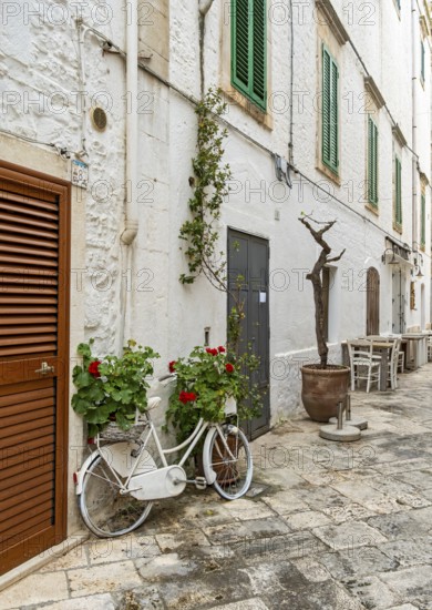 Narrow street with bicycle, Locorotondo, Apulia - Puglia, Italy