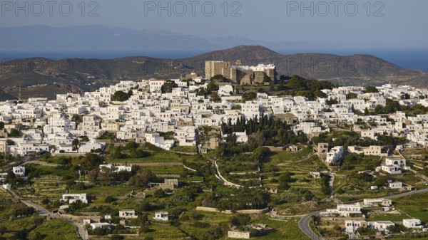 Panoramic view of a whitewashed village on a hill with a fortress on top, Monastery of St John the Theologian, Monastery of St John the Theologian, World Heritage Site 1999, Chora, Patmos, Dodecanese, Greek Islands, Greece