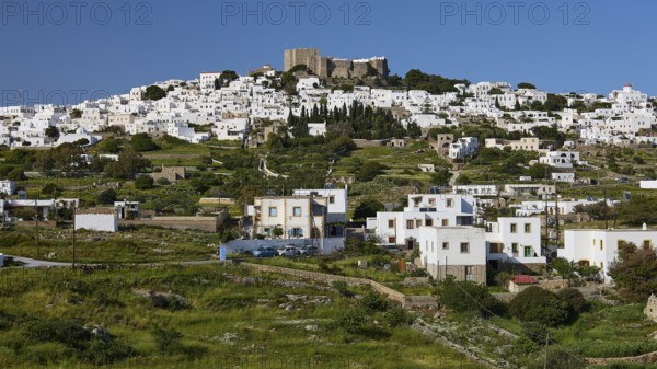 Whitewashed Mediterranean houses on a hill, crowned by an old fortress, Monastery of St John the Theologian, Monastery of St John the Theologian, World Heritage Site 1999, Chora, Patmos, Dodecanese, Greek Islands, Greece