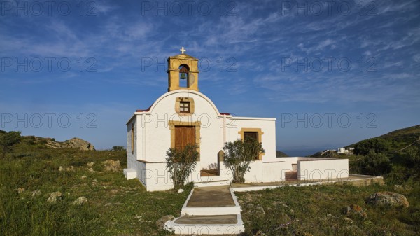 White chapel with bell tower in a rural, Mediterranean setting under a blue sky, chapel south of the Chora, World Heritage Site 1999, Chora, Patmos, Dodecanese, Greek Islands, Greece