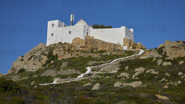 White building perched on a hill, accessible via stony steps, Church of the Prophet Elias, Profitis Ilias Chapel, Hermitage, Patmos, Dodecanese, Greek Islands, Greece